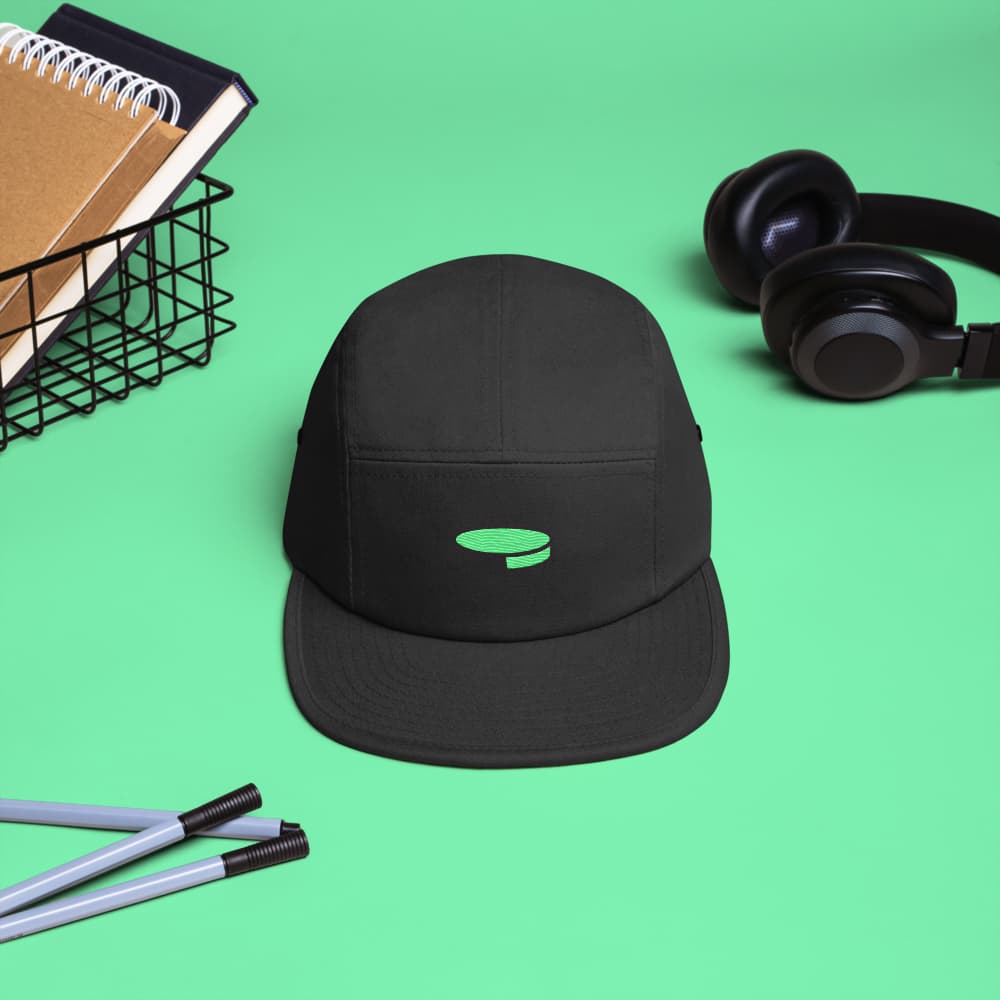 Black moneydevkit five-panel cap, front view with the green logo embroidery
