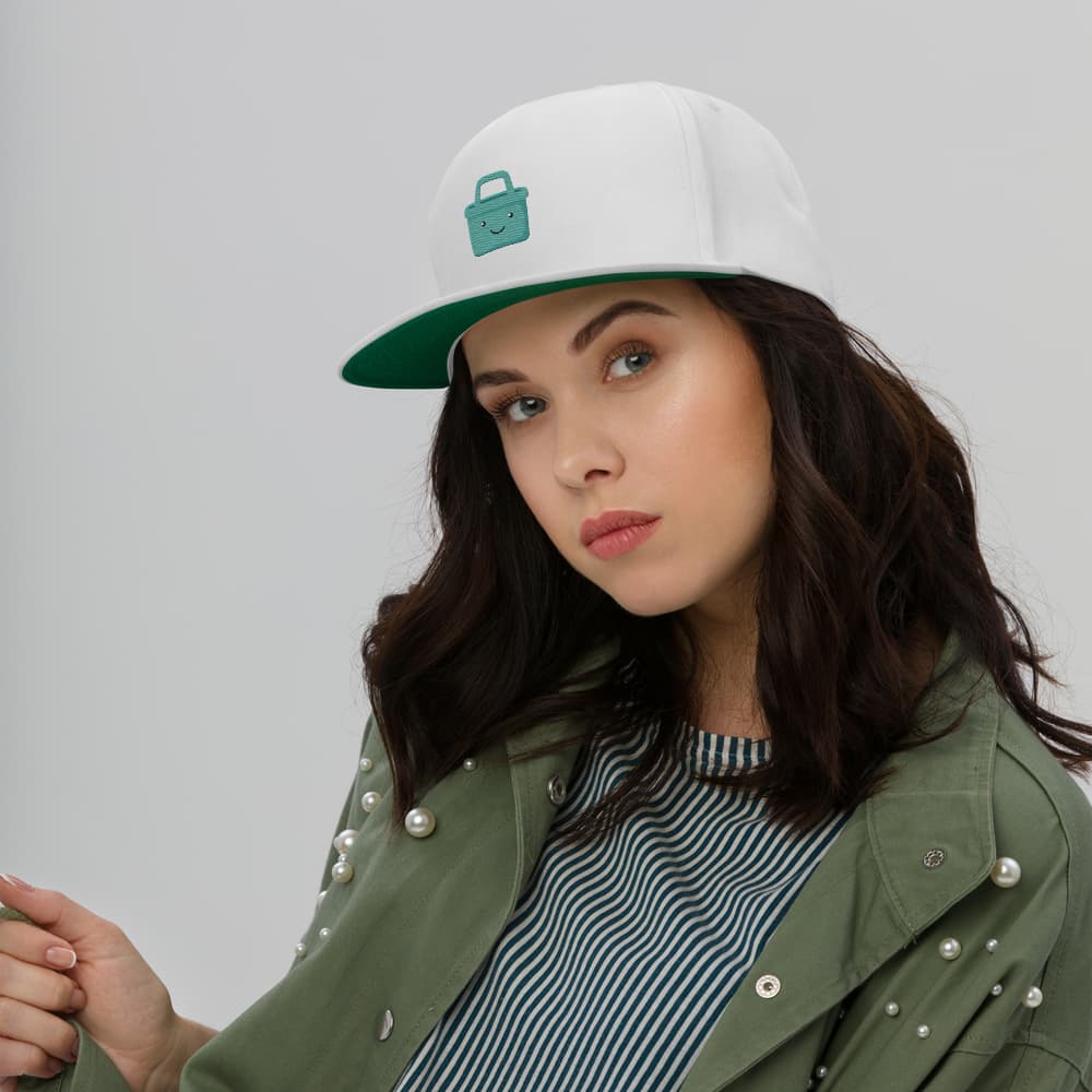 A woman wearing the white Ori flat-bill cap